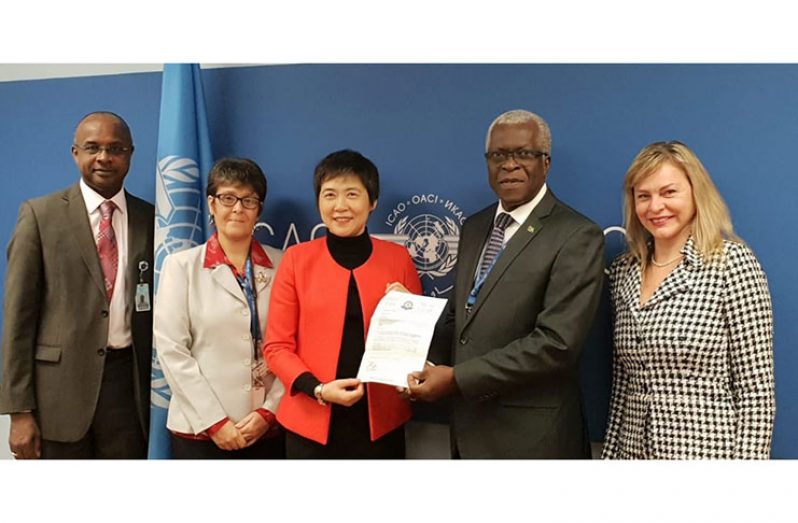 Director-General Lt. Col. (Ret’d) Egbert Field presenting Guyana’s Letter of Participation in the CORSIA programme to ICAO Secretary-General Dr. Fang Liu