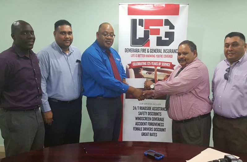 Demerara Mutual Life Assurance Society Limited Executive Marketing Manager Clarence Perry (third left) hands over the sponsorship cheque to GCB president Drubahadur in the presence of Colin Stuart (extreme left), GCB treasurer Anand Kalladeen (second left) and Marketing Manager Raj Singh.
