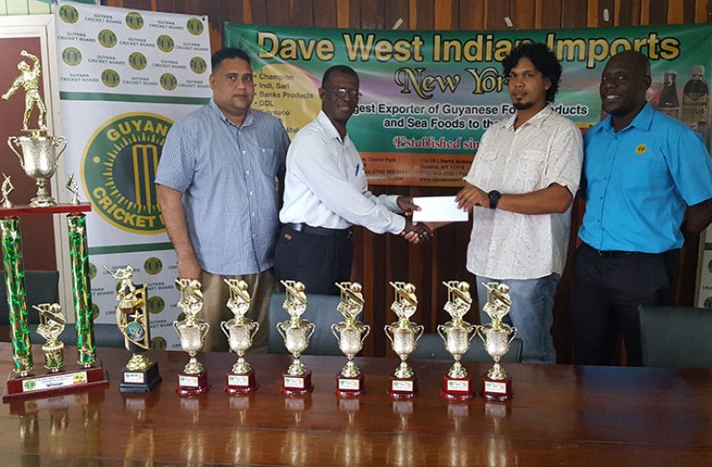 Dave West Indian Exports Guy-NY representative Cliff Joseph (second right) hands over the sponsorship cheque to GCB’s Chairman of Competitions Committee, Colin Europe. Colin Stuart (right) and GCB’s treasurer Anand Kalladeen share the moment.