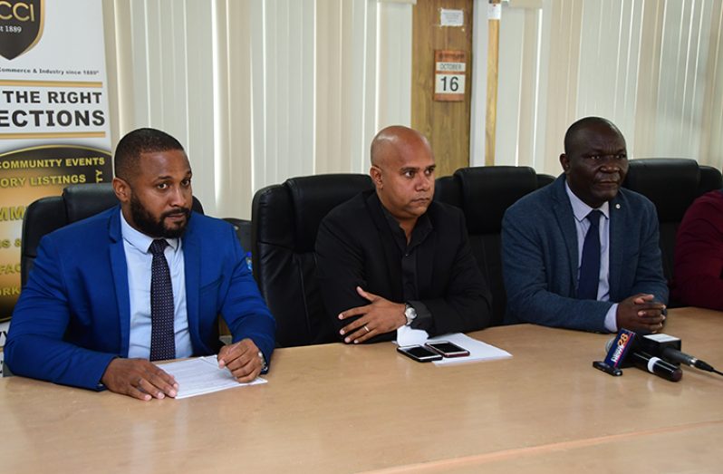 From left: CDB Operations officer for Micro, Small and Medium Enterprises, Zamani Moodie; GCCI Senior Vice-President, Timothy Tucker and Caribbean Technological Consultancy Services Network (CTCS) project officer, Eusi Evelyn (Adrian Narine photo)