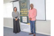 Minister of Labour Joseph Hamilton and GCCI President Ms. Kathy Smith