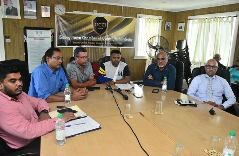 GCCI and MAPM members at Monday’s news conference. Seated from left are: GCCI Executive Director, Richard Rambarran; MAPM’s Don Singh and Marcel Gaskin; GCCI President, Deodat Indar; MAPM’s Komal Ramnauth; and GCCI Vice-President Nicholas Boyer (Photo by Adrian Narine)