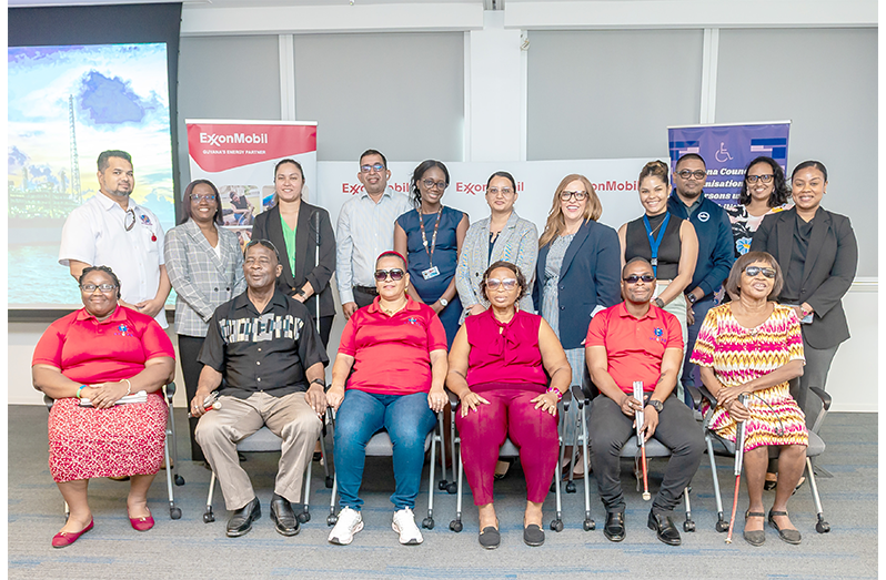 GCOPD and Exxon Mobil Officials with a few beneficiaries from the Independent Living Skills Programme (Delano Williams photo)