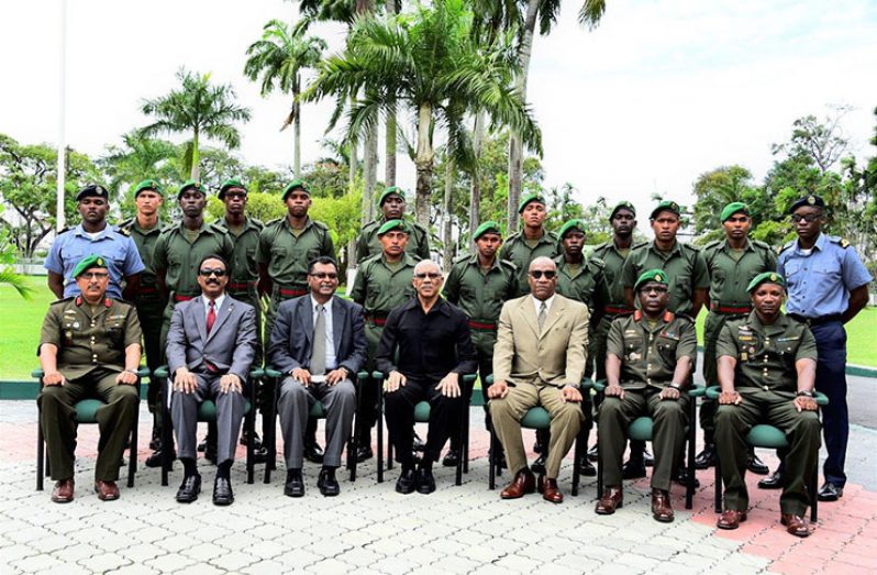 President David Granger poses with the newly-commissioned officers. The President is accompanied by (from left) Inspector General, Col. Nazrul Husain; Attorney General and Minister of Legal Affairs, Mr. Basil Williams. S.C.; Acting Prime Minister Mr. Khemraj Ramjattan, Minister of State, Mr Joseph Harmon; Chief of Staff of the GDF, Brigadier Patrick West and SOC 49 Course Officer, Major L. Benons