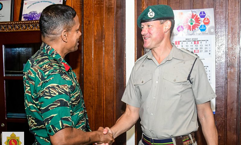Chief-of-Staff (ag), Colonel Omar Khan, greets UK Military Attaché to the Caribbean, Lieutenant Colonel Simon Westlake, at Defence Headquarters, Base Camp Ayanganna (GDF photo)