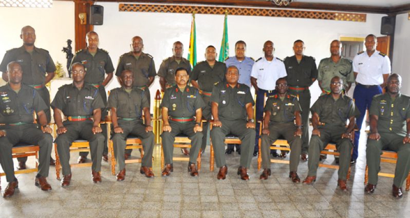 The graduates of the Senior Command and Staff Course (SCSC) Number 13, with the Chief of Staff (CoS), Brigadier Mark Phillips (fifth from left); Deputy CoC; senior officers and course staff following their graduation
