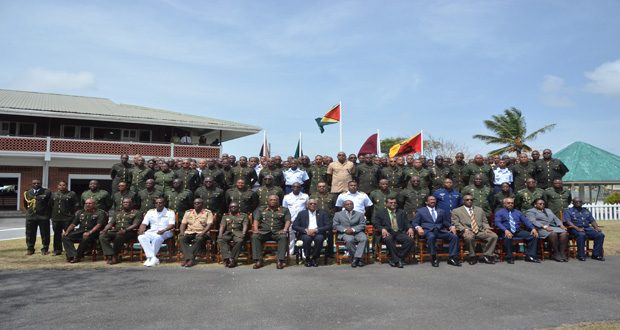 President David Granger, Chief of Staff Brigadier Mark Philips, Minister of Foreign Affairs Carl Greenidge, Minister of Public Security Khemraj Ramjattan, Attorney General Basil Williams and Minister of State Joseph Harmon (all seated in the front row) take a group photo with Officers of the GDF on Thursday at Camp Ayanganna.