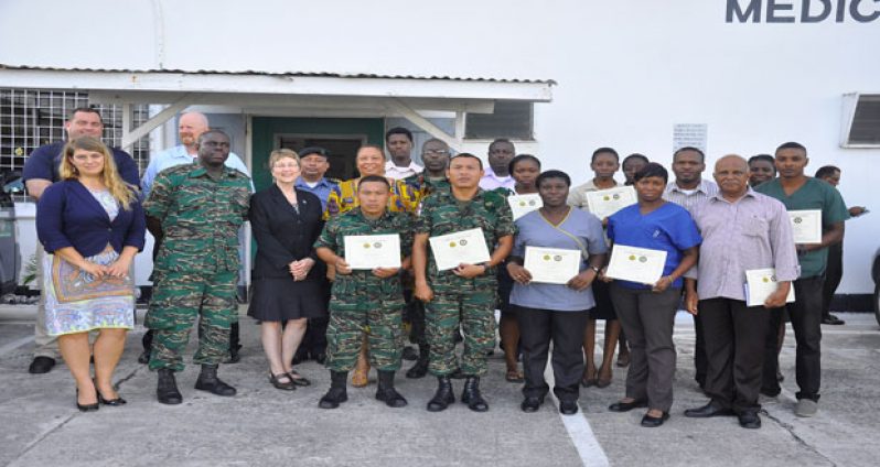 Mary Kratz (dressed in black) flanked by senior officers and army personnel trained to use the NTIS