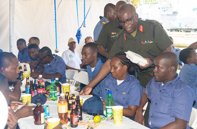 Chief-of-Staff Brigadier Patrick West shares lunches to Coast Guard ranks during the traditional Christmas lunch (Delano Williams photo)