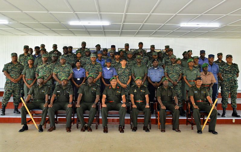 (Seated Center) Inspector General Colonel Nazrul Hussain flanked by senior GDF officers and soldiers who benefited from the Instructors course (GDF Photo)