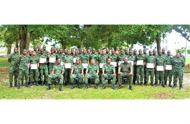The Skill-at-Arms, Internal Security and National Policy graduants in the company of senior officers (seated).