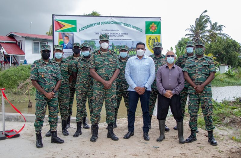 Minister of Local Government and Regional Development, Nigel Dharamlall; Regional Chairman of the RDC of Region Three, Sheik Ayube (right) and Brigadier Gary Beaton, Project Engineer of the Engineering Corps (left) with his team at Meten-Meer-Zorg (DPI photo)