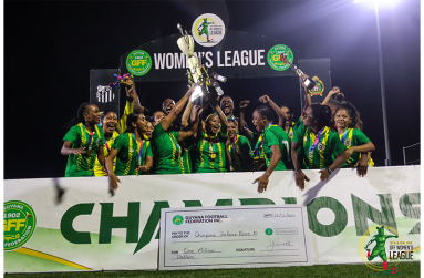 The victorious GDF women pose with their winning trophy at last Friday’s presentation ceremony