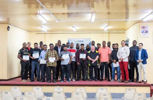 Permanent Secretary Dr Alfred King, flanked by GEA officials and the 25 graduates at the closing ceremony on Friday