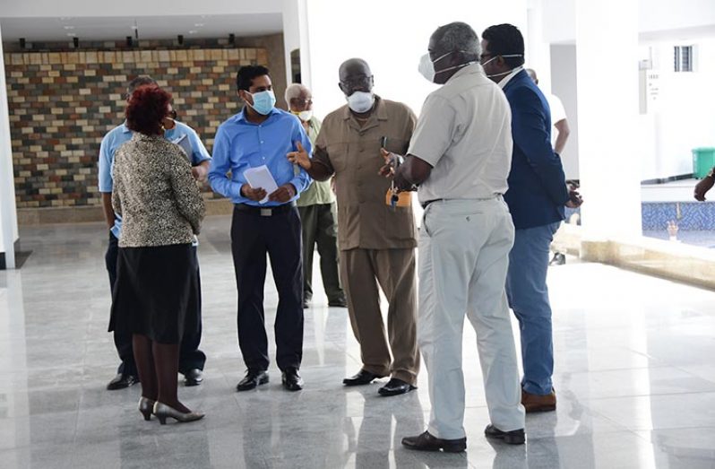 Chief Elections Officer, Keith Lowenfield (centre) in discussion with the Chair of GECOM Justice, (Ret’d) Claudette Singh, and other commissioners and officials at the ACCC on Wednesday