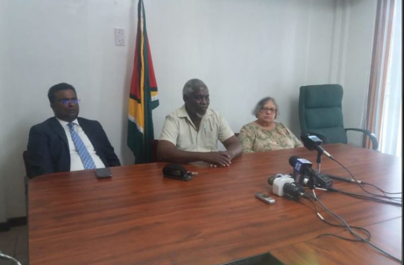 Opposition-appointed GECOM Commissioners Sase Gunraj, Robeson Benn and Bibi Shadick speaking to reporters during a press conference on Friday.