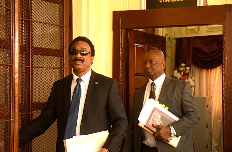 Attorney General and Minister of Legal Affairs, Basil Williams and Senior Counsel Neil Boston entering the courtroom at the High Court on Tuesday