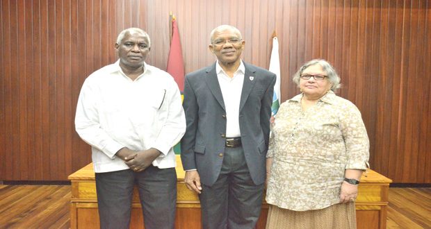 President David Granger (centre) with newly appointed GECOM commissioners Robeson Benn and Bibi Shadick