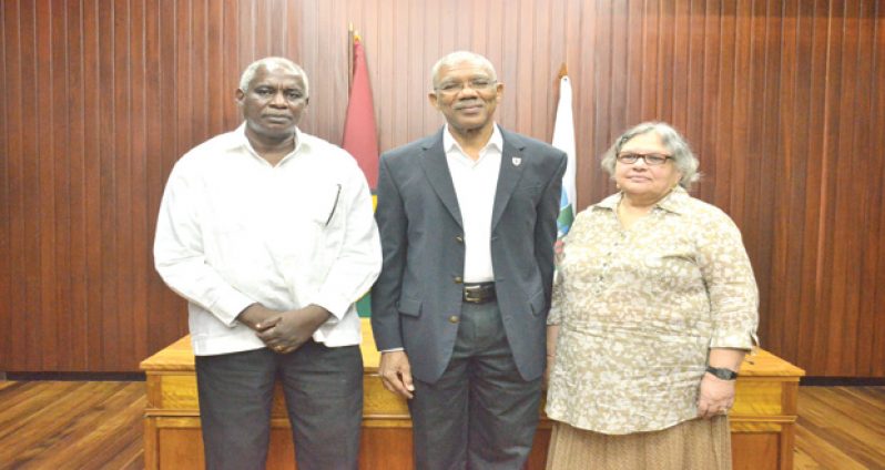 President David Granger (centre) with newly appointed GECOM commissioners Robeson Benn and Bibi Shadick