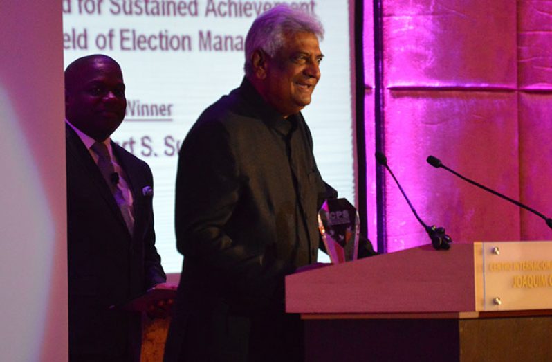 Dr. Steve Surujbally giving his acceptance speech at the event