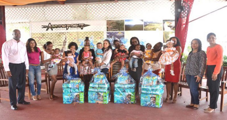 The happy babies and their parents pose with GEM and Ansa McAl representatives. (Carl Croker Photo)