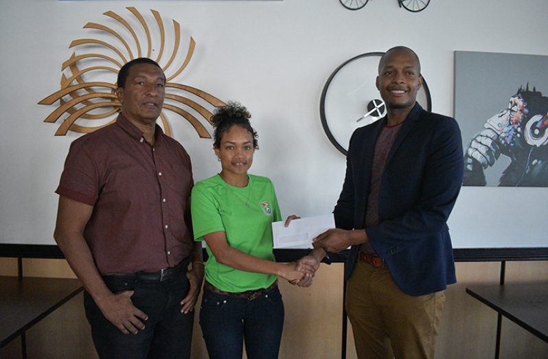 Lakeisha Pearson receives sponsorship cheque from German's CEO Clinton Urling in the presence of Kashif Mohammad.
