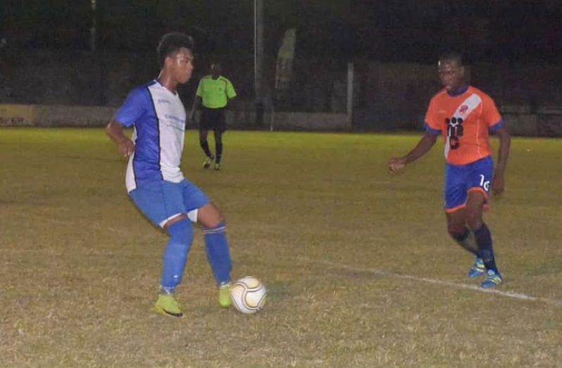 GFC captain Ralph Parris takes on a Fruta Conquerors defender in their semi-final last Sunday.