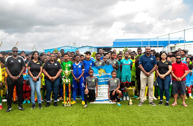 The teams took a photo-op with the officials before the kickoff (Shaniece Bamfield photos)