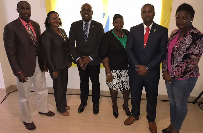 GFF president Wayne Forde (second from right), flanked by other Executive Committee members following yesterday’s Ordinary Congress (Rawle Toney photo).