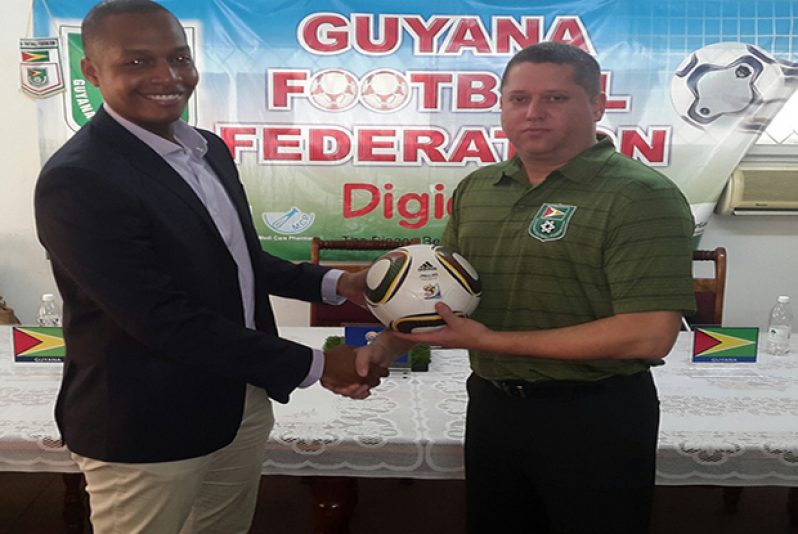 Welcome aboard! GFF Normalisation Committee Chairman Clinton Urling (Left) and New Technical Director Claude Bolton (Rawle Toney photo)