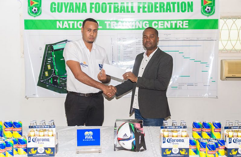 In Happier Times: GFF president Wayne Forde (R) and Corona Beer Brand Manager Marvin Wray at the launching of the Corona Beer Super 16 tournament.