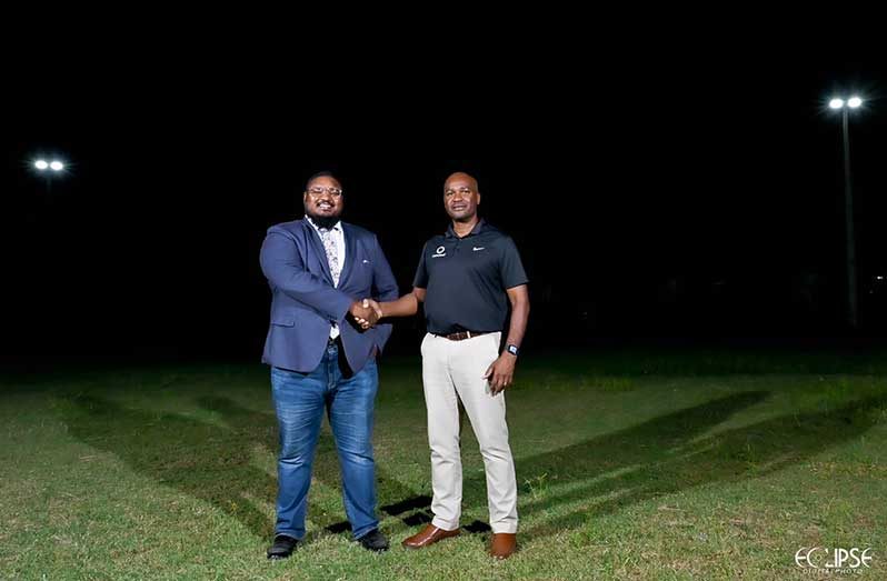 Guyana Football Federation President, Wayne Forde (right) and newly elected Fruta Conquerors Football Club President, Martin Massiah