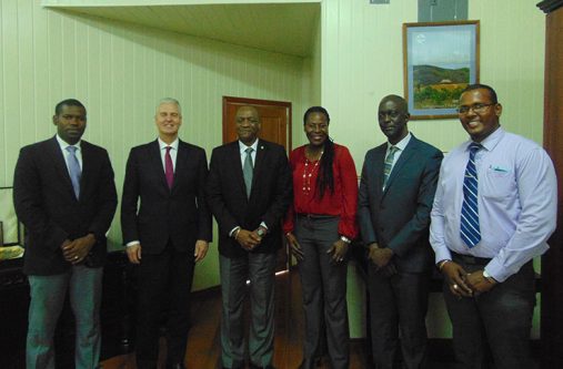 GGI Minister of State, Joseph Harmon with officials of GGI and other officials of Guyana
