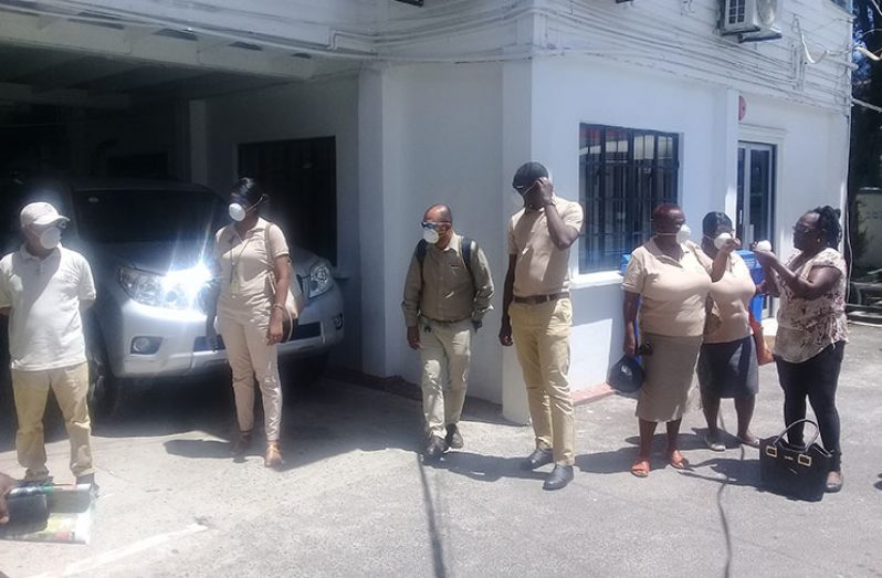 Some GGMC staffers who gathered in the compound with the masks before heading home