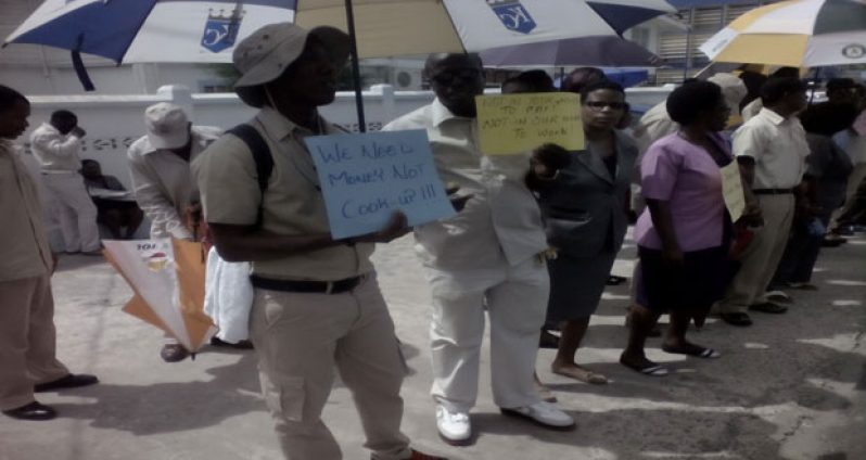 GGMC staff protesting in front of the Commission's Brickdam Office on Wednesday