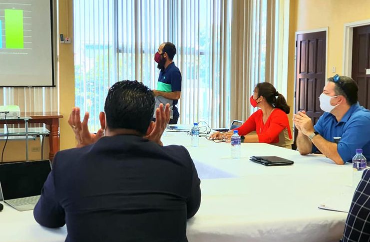 Minister of Sport Charles Ramson engages GHB executives during a PowerPoint presentation at their meeting last week. (Photo compliment: Ministry of Culture, Youth and Sport)