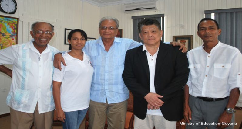 Minister of Education Dr Rupert Roopnarine (centre) with representatives of the the Guyana Karate College during their courtesy call.