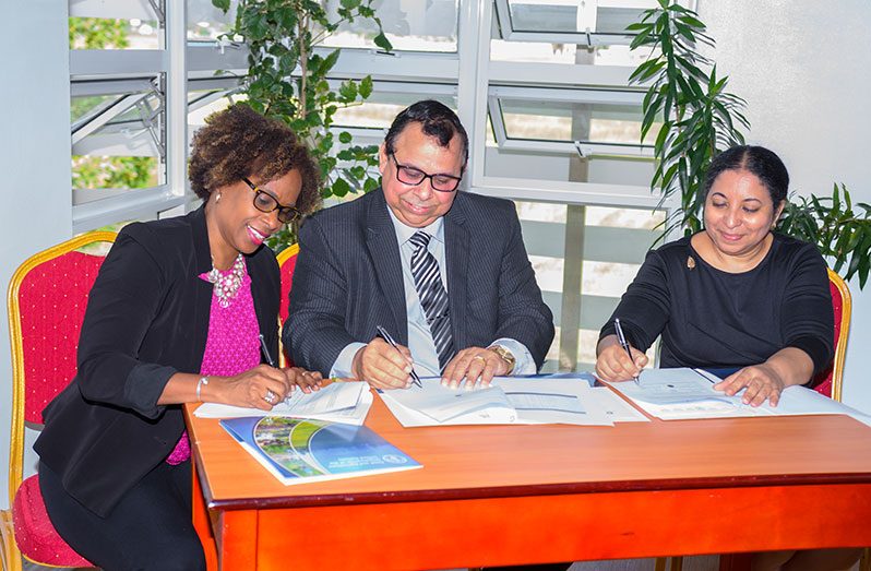 (From left) Resident FAO representative, Dr. Gillian Smith; Commissioner and Chief Executive Officer (CEO) of the GL&SC, Enrique Monize; and Vice-Chancellor of the University of Guyana, Dr. Paloma Mohamed, signing the Letter of Agreement on Monday, at the University of Guyana (Delano Williams photo)