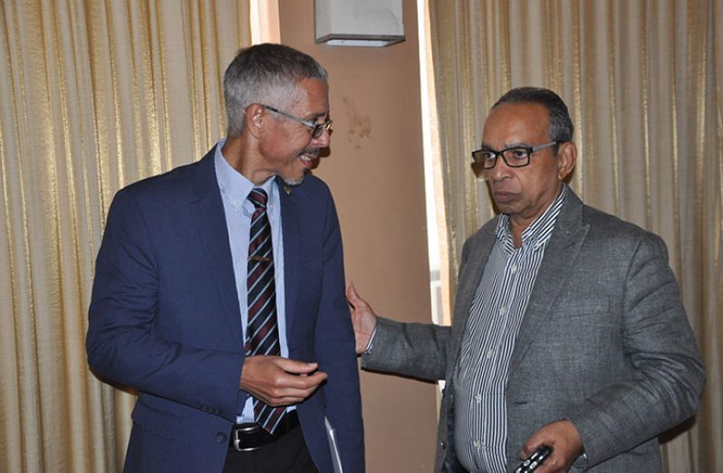 Minister of Business Dominic Gaskin chats with Private Sector Commission chairman, Eddie Boyer at the forum.