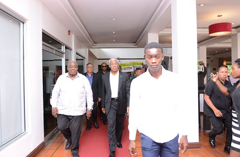 President David Granger and President of the GMSA, Clinton Williams, making their way to the GMSA Business Luncheon at the Pegasus Hotel (Delano Williams Photo)