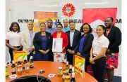 Manager and staff of Prestige Manufacturing and Bottling Enterprise with members of the Guyana Manufacturing and Services Association, Guyana Office for Investment and Region Three Chamber of Commerce
