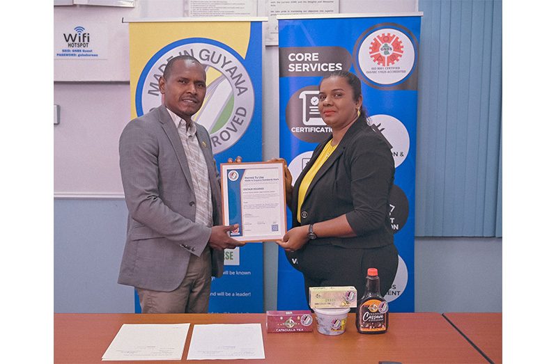 Centaur Holdings CEO, Oscar Richmond and General Manager, Michellina Richmond, pose proudly with GNBS Made in Guyana Certificate