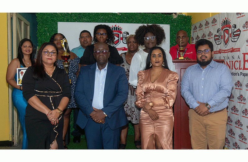 GNNL’s Heads of Department stand alongside the awardees. From left to right, General Manager Moshamie Ramotar, Director Aaron Fraser, Administrative Manager Aneeka Poonai, and Editor-in-Chief Navendra Seoraj (Japheth Savoury photo)