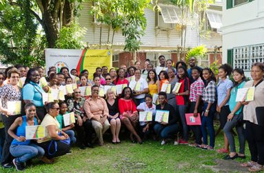 The participants pose with their certificates, sitting are (from left) GOA President K. A. Juman-Yassin, GOA VP, Dr. Karen Pilgrim, UNICEF Representative to Guyana and Suriname, Marianne Flach, and Minister responsible for Sport, Nicollette Henry