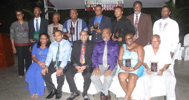 In this Sonnel Nelson photo, recipients of the various awards handed out by the Guyana Olympic Association at their 2014 Appreciation Ceremony on Friday evening at the Georgetown Club strike a pose with Minister of Sport Dr. Frank Anthony (sitting second left).