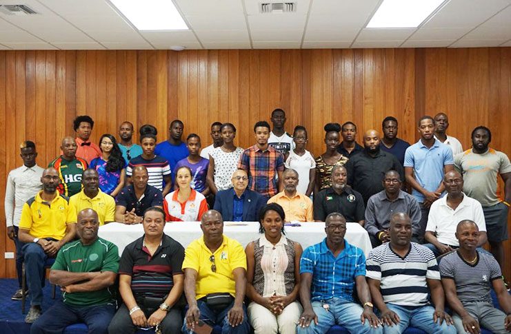 Some of the athletes and coaches at the Guyana Olympic Association yesterday. (Rawle Toney photo)