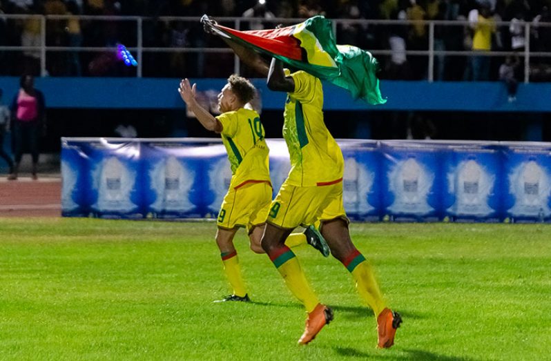 Gold Cup bound! Golden Jaguars players celebrating their 2 – 1 win against Belize at the National Track and Field Centre on March 23 (Samuel Maughn photo)