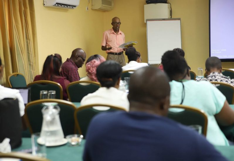 Local journalists listen to a presentation from veteran journalist, Denis Chabrol during a previous training session (Photo courtesy of GPA)