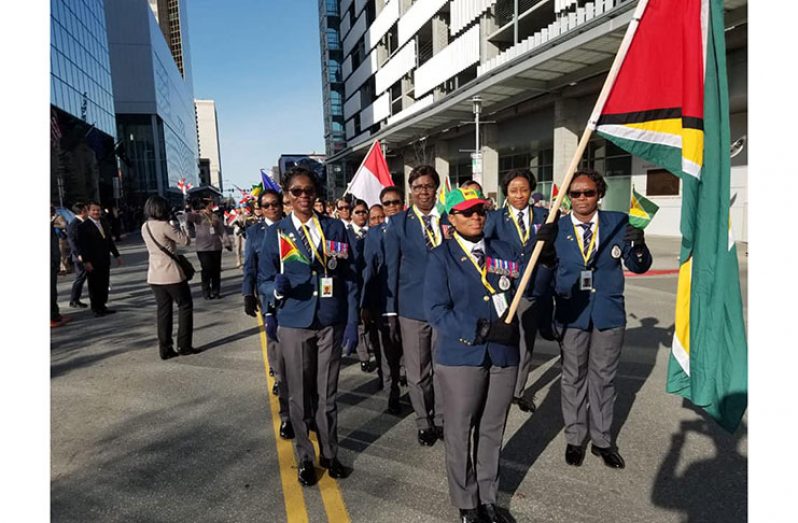 The Guyana Police Force contingent during a parade of nations through the downtown area of Alaska.
