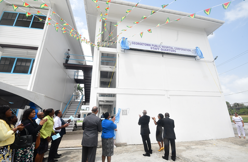President David Granger and others applaud the commissioning of the Medical Staff Quarters (Adrian Narine photo)